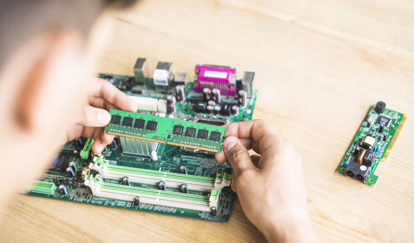 technician testing ram computer motherboard table Saravati