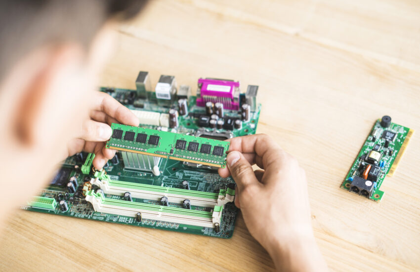 technician testing ram computer motherboard table Saravati